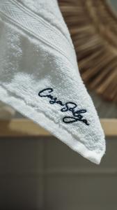 a white towel with the worderror written on it at CASA SALGA - MILAGRES - 3 mins a pé da praia da Capela in São Miguel dos Milagres