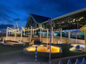 a building with a playground in front of it at night at Pebbles in Selsey