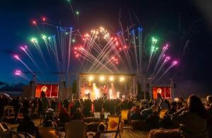a crowd of people watching a concert with fireworks at Pebbles in Selsey +16 photos