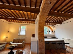 a living room with a couch and a table at Podere San Luigi in Sarteano