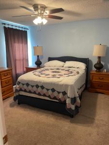 a bedroom with a bed and a ceiling fan at Magic Stay 4-Bedroom Home Close to Disney in Kissimmee