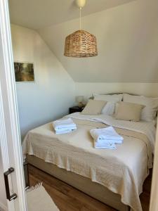 Postel nebo postele na pokoji v ubytování Fenn a Hegyen Vendégház Somló