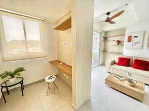 a living room with a couch and a table at Ámbar Roca / Rodadero in Rodadero +65 photos