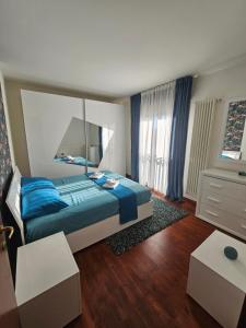 Ένα ή περισσότερα κρεβάτια σε δωμάτιο στο Blu Petrolio Stay All New with Gated Parking