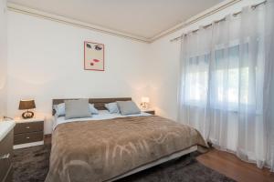 Postel nebo postele na pokoji v ubytování Apartman Verica
