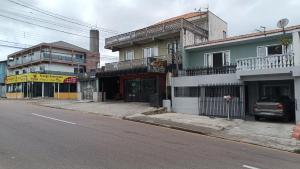an empty street in a city with a building at Sobrado in Curitiba