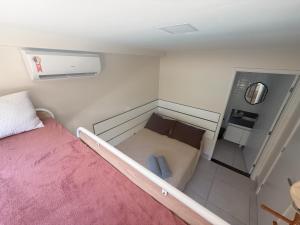 a small room with a bed and a kitchen at Sossego do Porto Galinhas Flats in Porto De Galinhas +48 photos