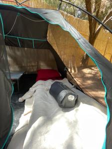 a tent with a bed in the middle at Afra Camp -- Paradise Valley in Agadir
