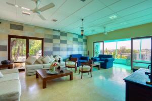 a living room with a couch and a table at Mount Marina Villas - HAZEL in Galle