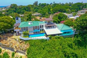 an overhead view of a house with a green roof at Mount Marina Villas - HAZEL in Galle