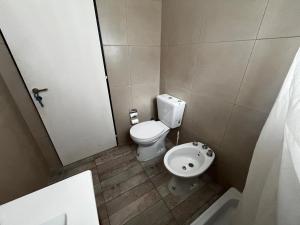 a small bathroom with a toilet and a sink at Isla La Scaloneta in Estación Delta +31 photos