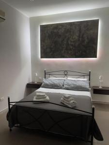 Ένα ή περισσότερα κρεβάτια σε δωμάτιο στο A Traversa Rooms
