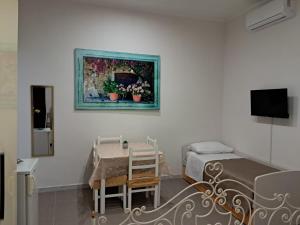 Μια τηλεόραση ή/και κέντρο ψυχαγωγίας στο A Traversa Rooms