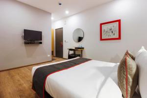 Ένα ή περισσότερα κρεβάτια σε δωμάτιο στο Super Townhouse RCC Elite +68 φωτογραφίες