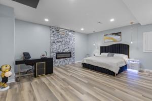 a bedroom with a bed and a desk and a piano at Stop the car Absolute opulence in Manassas +23 photos