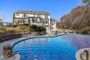 a large swimming pool in front of a house at Stop the car Absolute opulence in Manassas