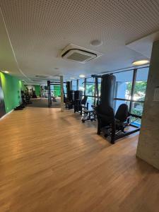 an empty office with chairs and a wooden floor at Beach Class Convation by MAI in Recife