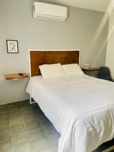 Ένα ή περισσότερα κρεβάτια σε δωμάτιο στο Tibe New and cozy studio at downtown