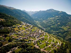 an aerial view of a village in the mountains at Apartment in Veysonnaz with pool in Veysonnaz