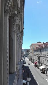 a view of a city street from a building at Brilliant Camere in Trieste