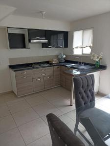 Kuchyň nebo kuchyňský kout v ubytování Hermosa casa en cluster privado