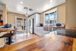 a kitchen with a table and a counter top at Jt Desert Dwelling in Twentynine Palms