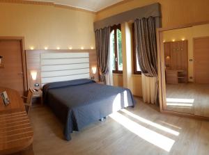 Postel nebo postele na pokoji v ubytování Hotel Vela D'oro ***S