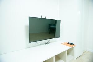 a flat screen tv sitting on top of a table at Yangyang Ocean Hill in Yangyang