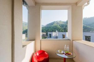 a room with a table and a large window at Hue Bless Spa Pension Gapyeong in P'yŏngban-ni