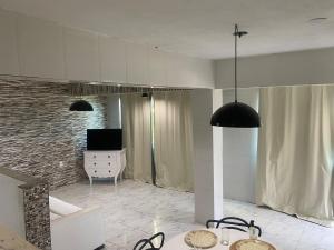 TV a/nebo společenská místnost v ubytování Loft Pescadores Vista Mar