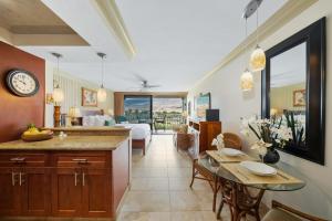 a kitchen and living room with a bed and a table at Lahaina Shores 512 · LS 512 Getaway Studio by the Beach Pool Hot in Lahaina