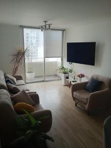 Μια τηλεόραση ή/και κέντρο ψυχαγωγίας στο Cozy apartment in San Miguel