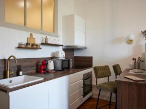 Η κουζίνα ή μικρή κουζίνα στο Charmant studio moderne avec wifi et animaux admis - FR-1-555-119