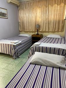 Katil atau katil-katil dalam bilik di Hotel Las Hortensias