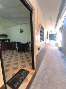 a room with a table and chairs and a mirror at Apartaments BK1 Iquitos in Iquitos +1 photo