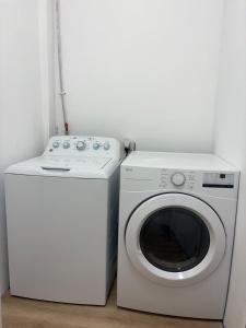 a washing machine and a washer in a room at Home Away Springs in Georgetown +3 photos