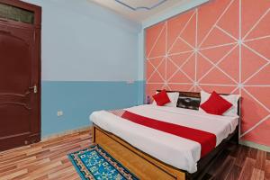 Katil atau katil-katil dalam bilik di Hotel O White Swan