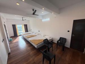 Ένα ή περισσότερα κρεβάτια σε δωμάτιο στο Vagamon Hill Casa Holiday Home +30 φωτογραφίες