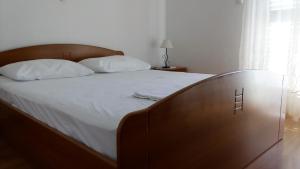 Postel nebo postele na pokoji v ubytování Guest House Karević