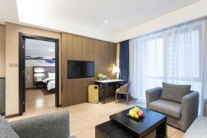 TV a/nebo společenská místnost v ubytování Yitel Shenyang Hunnan Olympic Sports Center Wanda Plaza