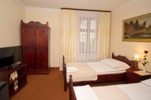 Postel nebo postele na pokoji v ubytování Hotel Retman