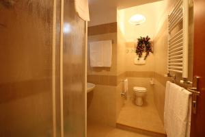 a bathroom with a toilet and a sink at Bed Breakfast And Cappuccino in Rome