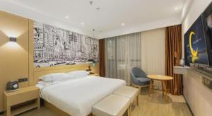 TV a/nebo společenská místnost v ubytování City Comfort Inn Chengdu Wenjiang Zhujiang Square Guanghua Park Metro Station