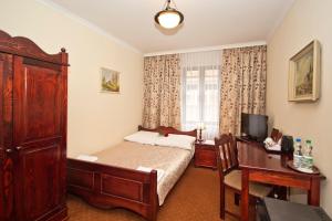 Postel nebo postele na pokoji v ubytování Hotel Retman