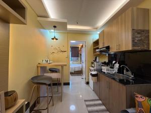 a kitchen with a sink and a counter top at Elly's Place in Quezon City