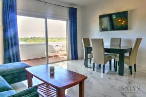 a living room with a table and chairs and a dining room at 1bd apartment with Gulf View Pointe Pirouette in Lowlands