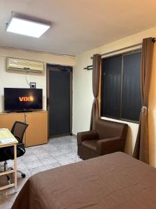 Televisyen dan/atau pusat hiburan di Habitación Cómoda Estadio BBVA, Domo Care, Arena