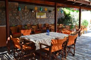a dining room with a table and chairs at iliopetro in Monemvasia