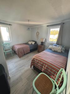 En eller flere senge i et værelse på Algarrobo descanso junto al mar