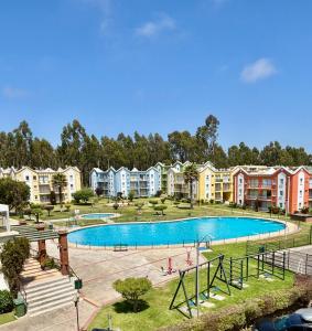 an image of an apartment complex with a swimming pool at Algarrobo descanso junto al mar in Mirasol